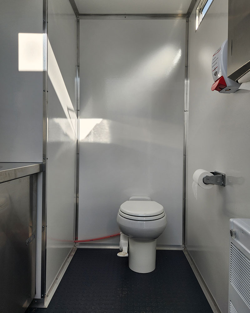 toilet inside a double restroom facility